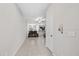 Bright, open-concept living room with tile flooring, neutral paint, and comfortable seating area at 10472 Shady Preserve Dr, Riverview, FL 33578