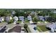 Aerial view of a charming neighborhood with well-maintained homes, lush greenery, and a peaceful residential streetscape at 10775 Glen Ellen Dr, Tampa, FL 33624