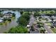 Picturesque aerial shot featuring homes nestled along a serene lakefront, surrounded by lush trees and a tranquil neighborhood setting at 10775 Glen Ellen Dr, Tampa, FL 33624
