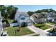 An elevated shot of a two-story home with a nice lawn, and a one-car garage at 10775 Glen Ellen Dr, Tampa, FL 33624