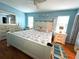 Bright bedroom with white furniture, light blue walls, and ceiling fan at 10775 Glen Ellen Dr, Tampa, FL 33624