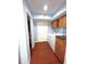 Laundry room with a washer, dryer, storage cabinets and direct bathroom access, combining convenience and functionality at 10775 Glen Ellen Dr, Tampa, FL 33624
