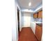 Laundry room with a washer, dryer, storage cabinets and direct bathroom access, combining convenience and functionality at 10775 Glen Ellen Dr, Tampa, FL 33624