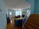 Bright living space with hardwood floors, fireplace, staircase, and front door entrance at 10775 Glen Ellen Dr, Tampa, FL 33624