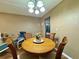 Dining room with seating for four under chandelier at 10800 Us Highway 19 N # 127, Pinellas Park, FL 33782