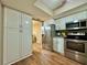 Bright kitchen featuring stainless steel appliances, and ample storage space at 10800 Us Highway 19 N # 127, Pinellas Park, FL 33782