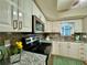 Well-lit kitchen featuring granite countertops and stainless steel appliances at 10800 Us Highway 19 N # 127, Pinellas Park, FL 33782
