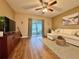 Comfortable living room with ceiling fan, sliding glass doors to patio, and stylish decor at 10800 Us Highway 19 N # 127, Pinellas Park, FL 33782