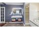 Bathroom featuring double sinks, and a separate shower and tub at 11029 Lynn Lake Cir, Tampa, FL 33625