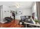 Bright bedroom features hardwood floors, closet, and a desk area, perfect for work or relaxation at 11029 Lynn Lake Cir, Tampa, FL 33625