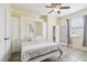 Bright bedroom with a Murphy bed, a ceiling fan, and beautiful natural light at 11029 Lynn Lake Cir, Tampa, FL 33625