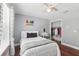 Inviting bedroom with hardwood floors, natural light, and closet access at 11029 Lynn Lake Cir, Tampa, FL 33625