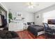 Sunlit bedroom features hardwood floors, a spacious closet, and dedicated workspace at 11029 Lynn Lake Cir, Tampa, FL 33625