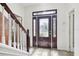 Elegant front entryway with a decorative glass door and tile flooring, creating a welcoming ambiance at 11029 Lynn Lake Cir, Tampa, FL 33625
