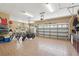 Spacious garage displaying tiled floors, ample storage, and space for vehicles at 11029 Lynn Lake Cir, Tampa, FL 33625