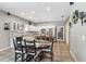 Bright and open kitchen and dining area featuring granite countertops, stainless steel appliances, and abundant storage at 11029 Lynn Lake Cir, Tampa, FL 33625