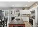 Spacious kitchen with stainless steel appliances, granite countertops, and an eat-in island, great for entertaining at 11029 Lynn Lake Cir, Tampa, FL 33625