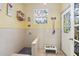 A dedicated pet shower area with decorative door, window, and feeding station at 11029 Lynn Lake Cir, Tampa, FL 33625