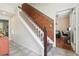 Staircase with tile accents and views into the living spaces at 11029 Lynn Lake Cir, Tampa, FL 33625