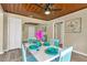 Dining room with hardwood ceiling and hardwood floors, with blue dining set at 1128 S 70Th St, Tampa, FL 33619