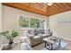 Cozy living room featuring a large window, comfortable seating, and stylish decor at 1128 S 70Th St, Tampa, FL 33619