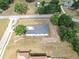 Aerial view of the home showcasing the lot, nearby road, and neighborhood at 11921 Fort King Hwy, Thonotosassa, FL 33592