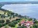 Aerial photograph reveals the property's expansive waterfront setting on a large lake at 11921 Fort King Hwy, Thonotosassa, FL 33592