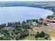 Aerial photograph reveals the property's expansive waterfront setting on a large lake at 11921 Fort King Hwy, Thonotosassa, FL 33592