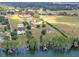 An overhead view highlights the lakefront community with single-Gathering homes at 11921 Fort King Hwy, Thonotosassa, FL 33592