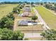 Aerial view of the home showcasing the lot, nearby road, and the neighborhood at 11921 Fort King Hwy, Thonotosassa, FL 33592