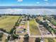 An aerial view showing the surrounding landscape, nearby lake, and the lot's placement at 11921 Fort King Hwy, Thonotosassa, FL 33592