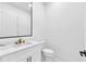 Modern bathroom with sleek vanity and a rectangular mirror for a contemporary look at 11921 Fort King Hwy, Thonotosassa, FL 33592