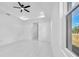 Bright bedroom with white walls and marble floors, recessed lighting and a ceiling fan at 11921 Fort King Hwy, Thonotosassa, FL 33592