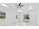 Bright bedroom with white walls and marble floors, recessed lighting and a ceiling fan at 11921 Fort King Hwy, Thonotosassa, FL 33592