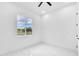 Bright, minimalist bedroom with a view and marble flooring at 11921 Fort King Hwy, Thonotosassa, FL 33592