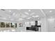 Sleek, modern kitchen with marble floors, an island, and stainless steel appliances at 11921 Fort King Hwy, Thonotosassa, FL 33592