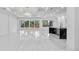 Open-concept living space with marble floors, modern lighting, and sliding glass doors for seamless indoor-outdoor living at 11921 Fort King Hwy, Thonotosassa, FL 33592