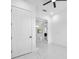 View of the living room through the doorway with large windows and recessed lighting at 11921 Fort King Hwy, Thonotosassa, FL 33592
