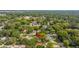 Aerial view of a property surrounded by mature trees in a residential neighborhood at 1216 E Lambright St, Tampa, FL 33604