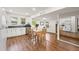 Bright eat-in kitchen with stainless steel appliances, wood floors and ample counter space at 1216 E Lambright St, Tampa, FL 33604