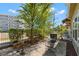 Backyard patio with outdoor seating, AC unit, and view of the street at 1271 Drew St, Clearwater, FL 33755