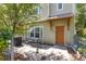 Exterior of home with an orange front door, a small table, and an ADT security system sign at 1271 Drew St, Clearwater, FL 33755