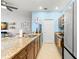 Bright kitchen featuring granite countertops, stainless appliances, and sleek cabinets at 1271 Drew St, Clearwater, FL 33755