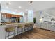 Open kitchen featuring a breakfast bar, granite countertops, and stainless steel appliances at 1271 Drew St, Clearwater, FL 33755
