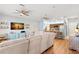Open-concept living room and kitchen with modern decor and wood flooring at 1271 Drew St, Clearwater, FL 33755