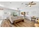 Bright living room featuring wood floors, fan, neutral furniture, and natural light at 1271 Drew St, Clearwater, FL 33755