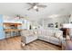 Bright living room flows to kitchen with hardwood floors and neutral wall color at 1271 Drew St, Clearwater, FL 33755