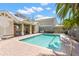 Community pool with chairs and tables in covered area and an adjacent building at 1271 Drew St, Clearwater, FL 33755