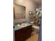 Modest bathroom featuring a combination tub and shower and a single sink vanity at 12720 Jan St, San Antonio, FL 33576
