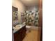 Modest bathroom featuring a combination tub and shower and a single sink vanity at 12720 Jan St, San Antonio, FL 33576